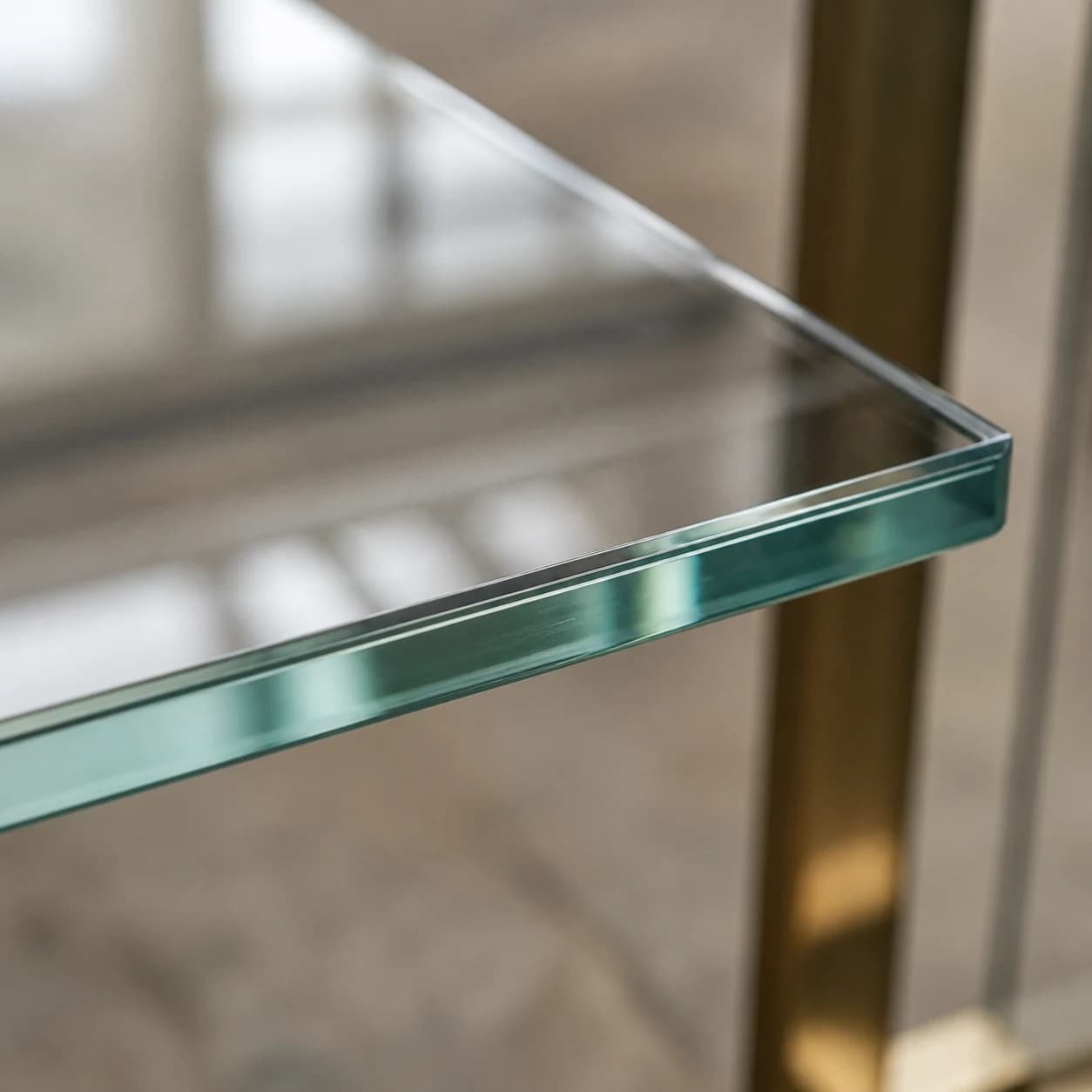 Bevelled glass shelf edge detail in studio lighting