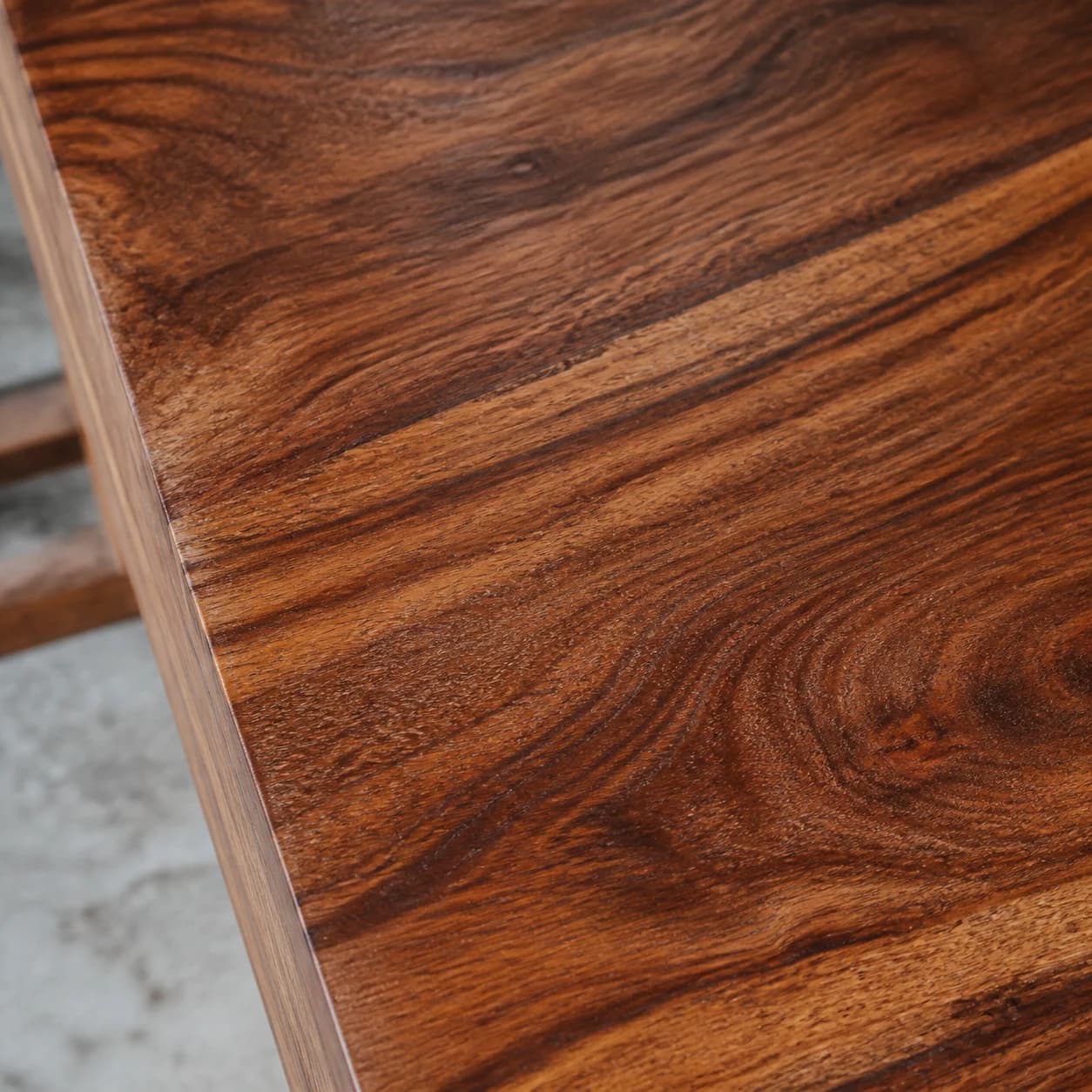 Close-up of sheesham wood grain with natural finish